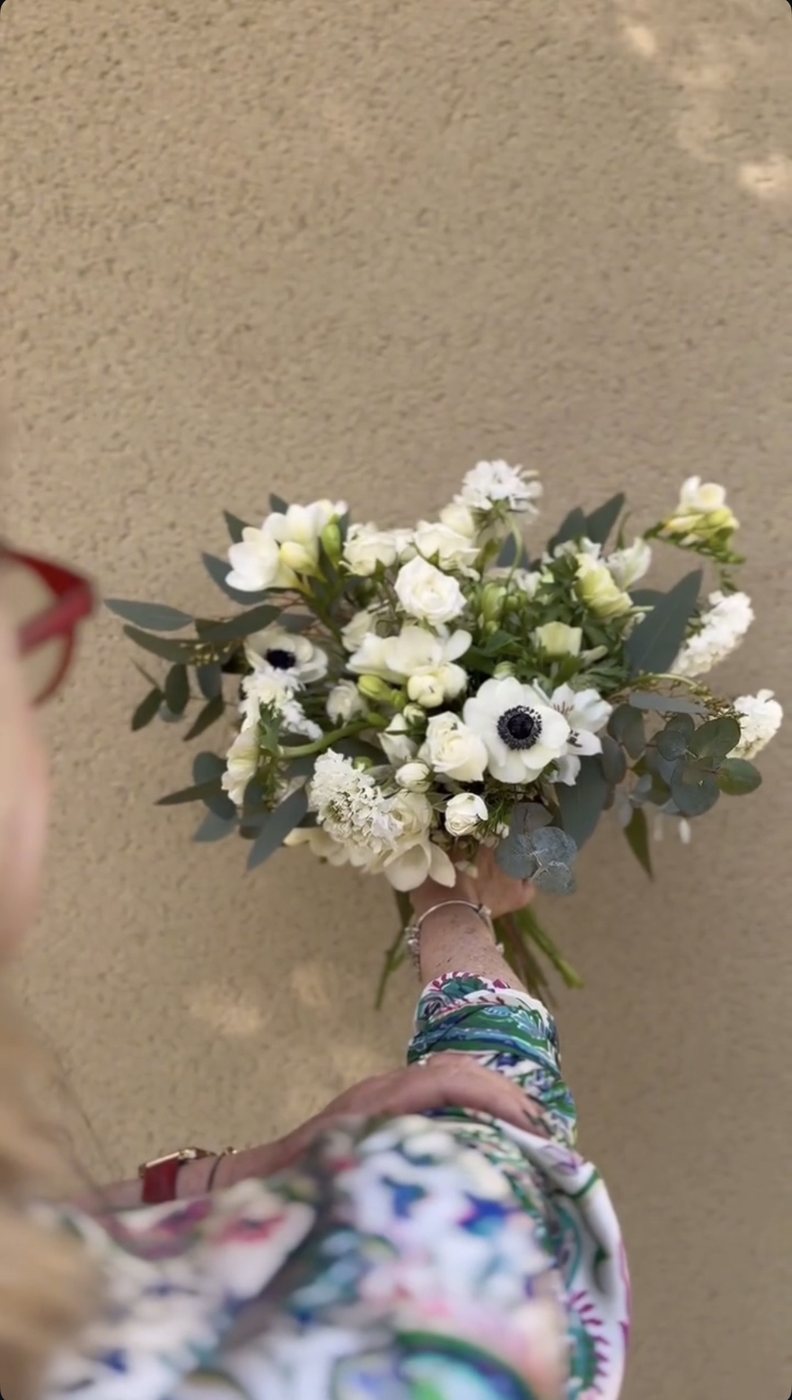 White anemone bouquet held in hand
