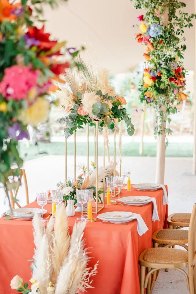 Colourful tablescape under a reception tent