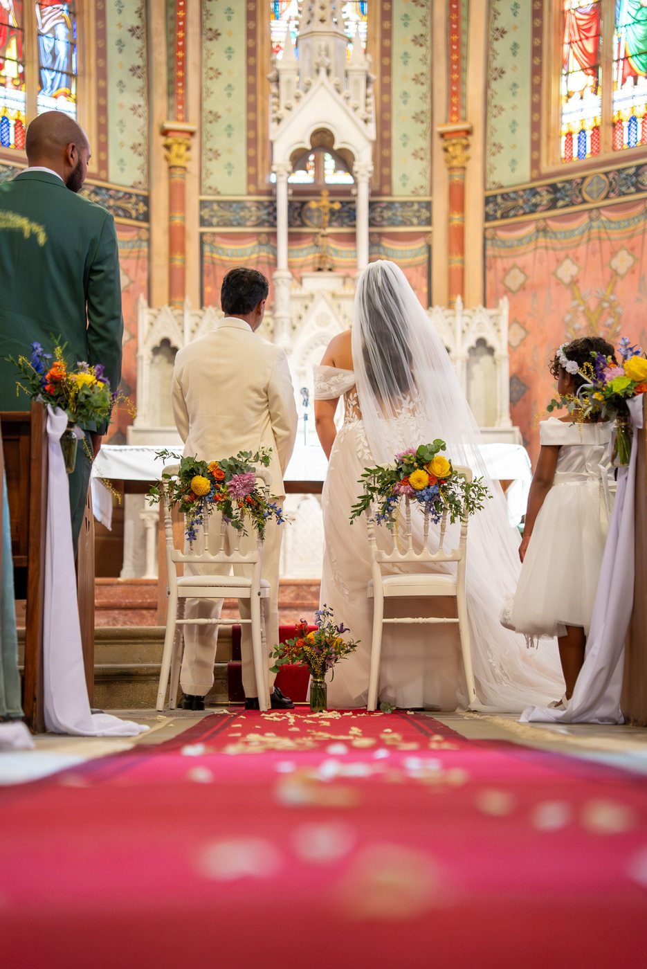 Church ceremony in flowers, newlyweds at the altar