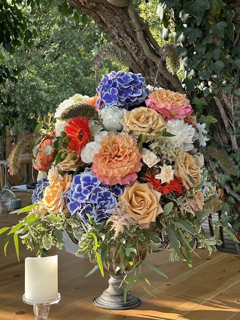 Summer arrangement with hydrangeas and roses