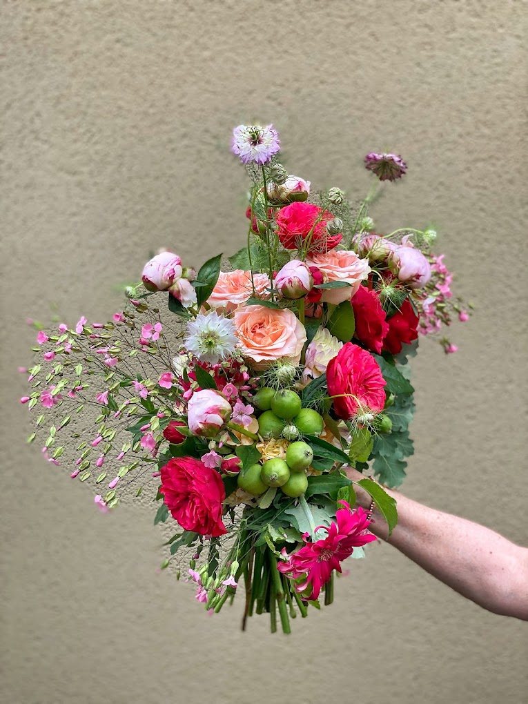 Vivid bouquet of red roses and foliage