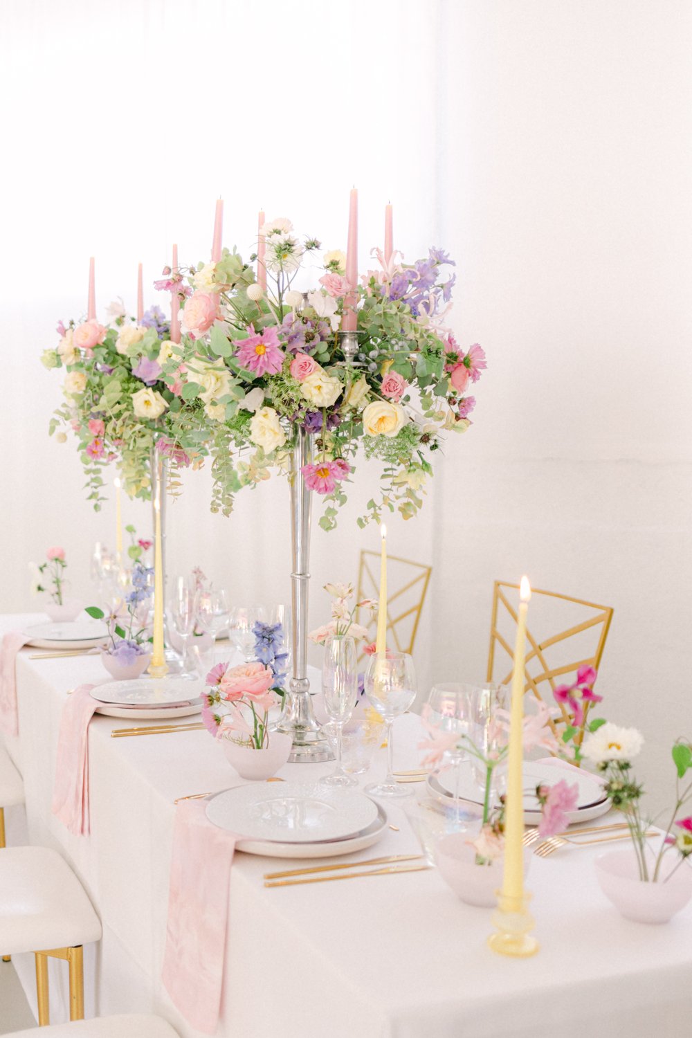 Pastel reception table with floral candelabra